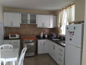 Kuchyň nebo kuchyňský kout v ubytování Casa, Hospedaje Turístico.