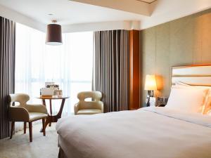 Cama o camas de una habitación en Shantou International Hotel