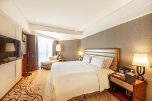 Cama o camas de una habitación en Shantou International Hotel