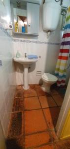 a bathroom with a sink and a toilet at Punta Ballena- Rancho Civil- Casa de Campo, Piscina y Playa in Punta del Este