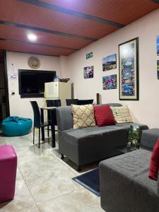 a living room with a couch and a table at Apartamento Casa Betty Salento. in Salento