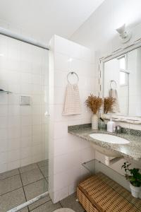 Ванная комната в Apartamento 3 quartos +2 garagens+2 banheiros a 40m da Praia dos Ingleses/florianopolis