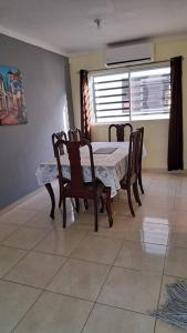 a dining room with a table and chairs and a window at c. Juan Bosch 15m to the beach in La Javilla