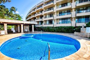 a large swimming pool in front of a building at Paki Maui 414 in Kahana