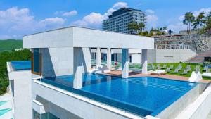 a swimming pool on top of a building at Stone Island Pool Villa in Yeosu