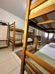 a room with two bunk beds in a room at Hostel Native in Boa Vista