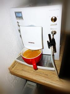 a coffee maker sitting on top of a table at Ditton apartment city center in Daugavpils