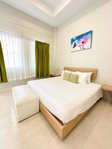 a bedroom with a large bed in a room at Favorite Place in Kata Beach