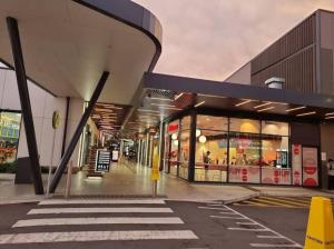 an empty street with a shopping mall with a store at 5 bedroom new house (no stairs) in Marsden Park