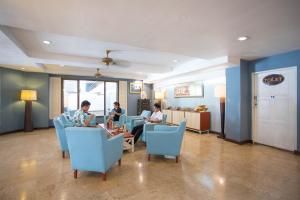 a group of people sitting in a waiting room at Sawasdee Siam Hotel in Pattaya Central