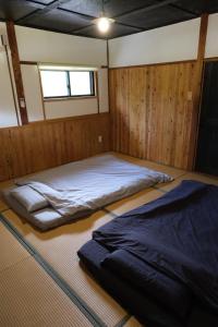 Postel nebo postele na pokoji v ubytování hostel+cafe たね