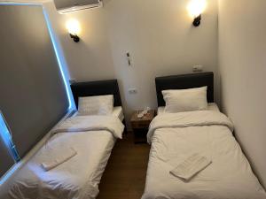 Letto o letti in una camera di Apple cozy hotel