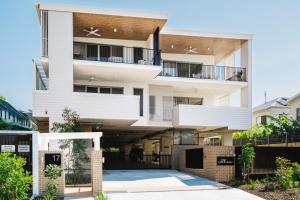 a large white building with balconies on it at New Modern Condo 400m to the Beach in Coolum Beach