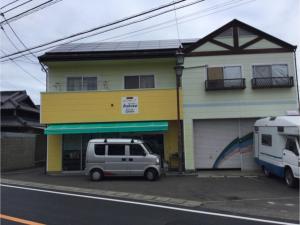 a van parked in front of a building at Guest House Ihatov - Vacation STAY 22122v in Takamatsu
