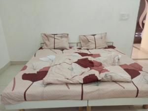 a bedroom with a large bed with at DWARKA BUNGALOW Only Family Full Bungalow in Dwarka