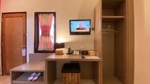 Televisor o centre d'entreteniment de Mawar Asri Hotel