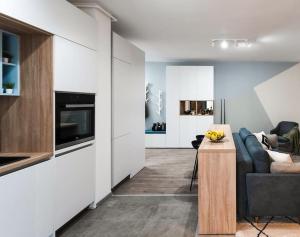 a living room with a couch and a table at Apartment Vivalia V6, free private parking in Timişoara