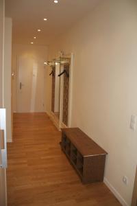 a hallway with a wooden table in a room at Premarental Apartment in Vienna