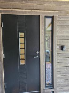 a black door with a window on a house at Panorama wiev in Stranda