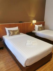 Postel nebo postele na pokoji v ubytování Manomon residence มโนมน เรสซิเดนซ์