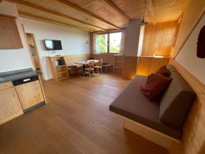a living room with a couch and a table at Oberfahrerhof in San Genesio Atesino