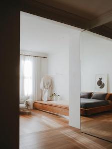 a bedroom with a bed and a window at The Bercin in Sydney