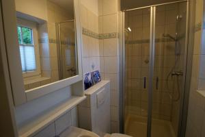 a bathroom with a shower and a toilet and a sink at Bootsmann in Brasilien +14 photos