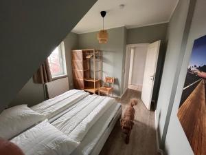 En eller flere senge i et værelse på Friesenhaus Vier Jahreszeiten