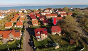 an aerial view of a residential neighborhood with a red roof at Kira in Schönberger Strand