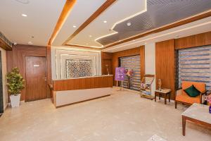 a lobby with a waiting room with a reception desk at Regenta Inn Luxinna Heights Mcleodganj in Dharamshala +46 photos