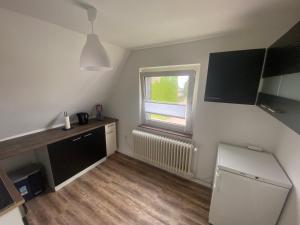 TV a/nebo společenská místnost v ubytování Ferienhaus mit zwei Einheiten in Oldenburg