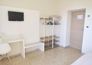 TV a/nebo společenská místnost v ubytování Hotel Del Golfo
