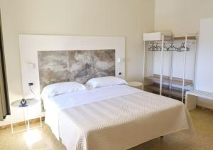 Postel nebo postele na pokoji v ubytování Hotel Del Golfo