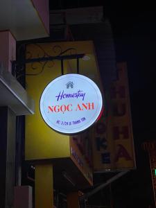 a sign for a nrocog amil on a building at Ngọc Anh homestay in Thôn Kim Long (1)