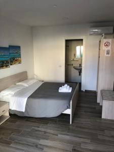Voodi või voodid majutusasutuse Academy Hotel toas