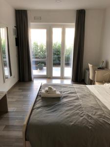 Voodi või voodid majutusasutuse Academy Hotel toas