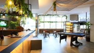 a bar with a ping pong table in a restaurant at ICI HOTEL Ueno Shin Okachimachi in Tokyo