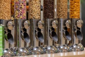 a display of different types of cereals and spoons at Hotel NordRaum in Bremen