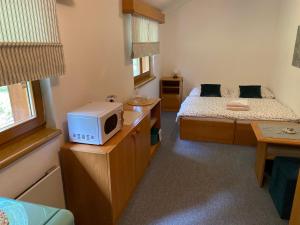 Letto o letti in una camera di Samoobslužný hotel Vydra