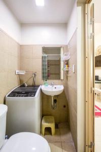 a small bathroom with a sink and a toilet at Affordable condotel near Manila Airport in Manila