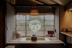 a room with a large window and a chair at Peace of mind in Jeju +53 photos