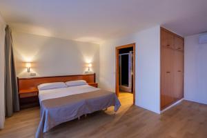 Posteľ alebo postele v izbe v ubytovaní IROCO HOSTAL
