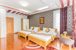 En eller flere senger på et rom på Min Villa Đà Lạt