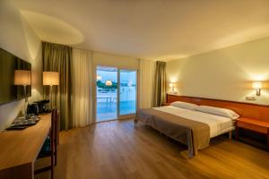 Posteľ alebo postele v izbe v ubytovaní IROCO HOSTAL