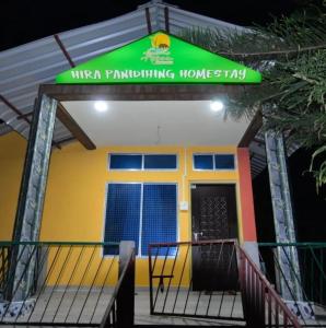 uma casa com um sinal na frente dela em Hira Panidihing Homestay em Sibsāgar
