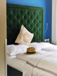 Łóżko lub łóżka w pokoju w obiekcie Hotel Villa Carlton - Adults Only