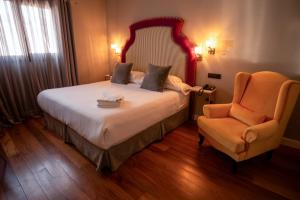 Postel nebo postele na pokoji v ubytování Hotel Don Juan Boutique
