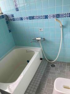 Ванна кімната в 桂浜龍馬に1番近い宿ペットと泊れる一軒家龍馬庵