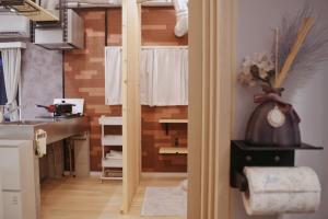 a view of a kitchen from a door of a room at 2 巣鴨駅5分 5人房 1LDK 便利热闹丨Sugamo JR Line 5 minutes 5people in Tokyo