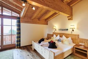 Postel nebo postele na pokoji v ubytování Berggasthof Platzlalm